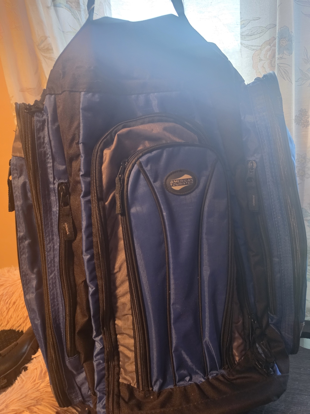 American Tourister Blue Multi-Pocket Men’s Backpack With Wheels